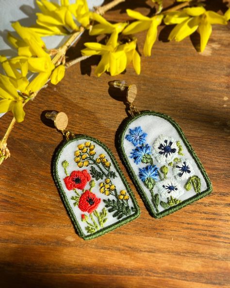 Spring it up!🤸‍♀️🌼 The weather is finally warming up and i have been so excited to post my new creations. What flowers can you recognise on these earrings?:) #embroidery #embroideryearrings #flowerart #fiberart #inspiredbynature #handmadejewelry Tansy Flower, Earrings Asymmetrical, Poppy Earrings, Embroidered Buttons, Diy Wire Earrings, Embroidered Earrings, Witchy Crafts, Asymmetrical Earrings, Earring Stud