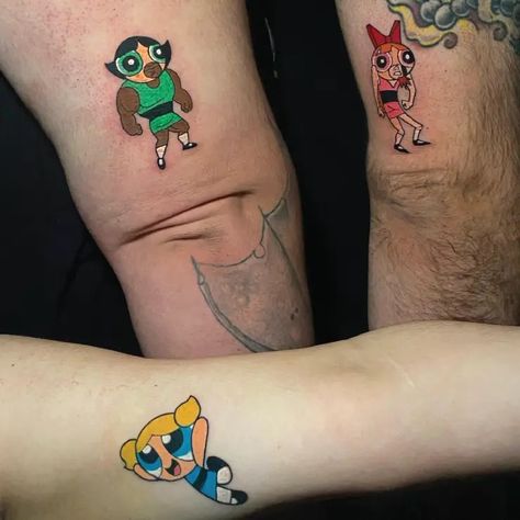 Matching Color Powerpuff Girls Cartoon Siblings Small Tattoo Idea & Design on Arms Matching Powerpuff Girls Siblings Tattoo Done At Powerpuff Girls Tattoo Siblings, Cartoon Siblings, Powerpuff Girls Tattoo, Bae Tattoo, Siblings Tattoo, Powerpuff Boys, Cousin Tattoos, Powerpuff Girls Cartoon, Matching Sister Tattoos