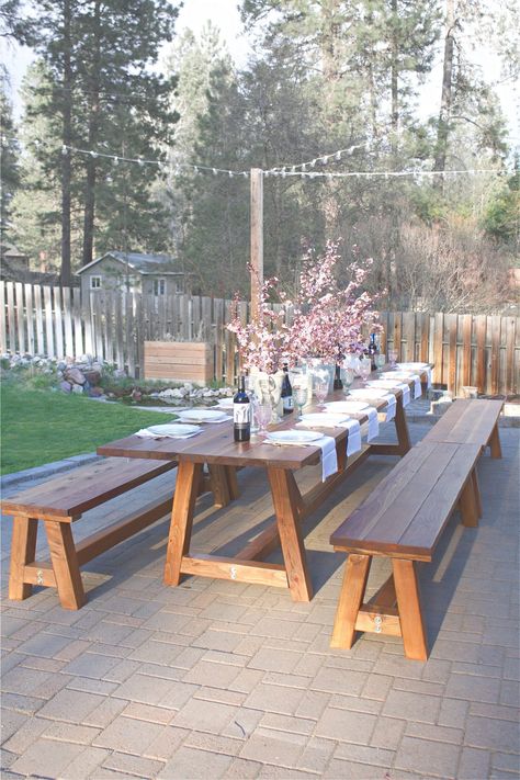 This Pinterest worthy outdoor table was constructed in two days, and took another three days total to sand, stain, and poly. It's the perfect outdoor wooden table. This pine table sits 16 comfortable on the sides, with another 2 possible at each end, for a total of 20 people! Considering all our outdoor gatherings, it's the perfect outdoor accessory. Outdoor Wooden Table, Outdoor Dining Table Diy, Meja Outdoor, Outdoor Farmhouse Table, Wooden Outdoor Table, Outdoor Dinner Table, Outdoor Wood Table, Backyard Table, Wooden Garden Table