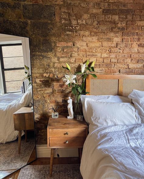 Small nyc apartment with exposed brick. White and clean decor. Brick Interior Apartment, Brick Boho Bedroom, Apartment Decorating Brick Wall, New York City Apartment Studio Brick Walls, Bedroom Ideas Exposed Brick, Exposed Brick Apartment Decor, Exposed Brick Apartment Decoration, Exposed Brick Loft Bedroom, Bedroom With Red Brick Wall