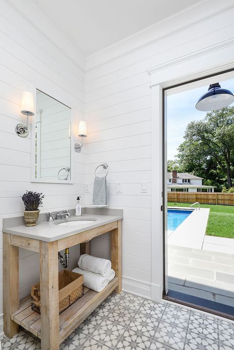 The room was designed with outdoor access leading to the pool and open-air shower. Small Pool Bathroom Ideas, Small Pool Bathroom, Pool House Bathroom Ideas, Pool House With Bathroom, Pool Bathroom Ideas, Outdoor Pool Bathroom, Small Pool House, Cabana Bathroom, Pool House Bathroom