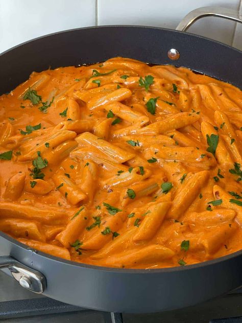 Penne alla vodka, freshly made in a pan. Cheesy Vodka Pasta, Spicy Vodka Gnocchi, Creamy Vodka Pasta Recipes, Penne Alla Vodka With Sausage, Penne Alla Vodka Without Vodka, Creamy Penne Alla Vodka, Best Vodka Pasta Recipe, Alla Vodka Pasta Recipes, Vodka Sausage Pasta