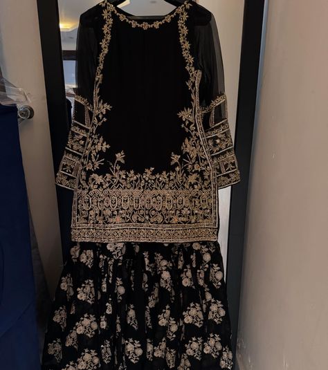 It’s all about black, a perfect wedding outfit for this upcoming wedding season Black formal outfit with zardozi work on shirt paired with embellished gharara and gotta finished silk dupatta For order and details please dm | visit kehkeshan.aamir | or whatsapp us on 03115693004 [ Kehkeshan kehkeshanz black gharara formal wedding wear laamofficial Pakistanifashion ] Black Lehenga Outfit, Black Garara, Black Formal Outfit, Black Gharara, Gharara Pakistani, Garara Dress, Long Skirt Top Designs, Simple Long Dress, Long Skirt And Top