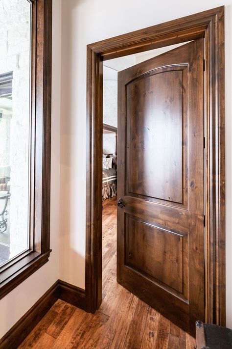 This large natural wood door is a timeless piece. And when combined with natural wood trim and natural wood flooring, it becomes a timeless masterpiece. Woodgrain Doors offers doors like this one as well as many other varieties. Check them out! Stained Interior Doors, Interior Doors Stained, Dark Wood Interior, Brown Interior Doors, Stained Wood Trim, Natural Wood Trim, Dark Wood Trim, Wood Baseboard, Stained Trim