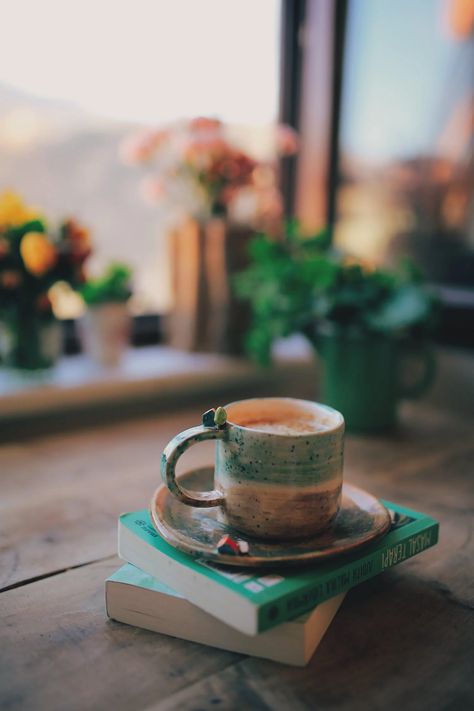 Cup of Coffee on Stack of Books by Window · Free Stock Photo Tea And Books, Coffee Pictures, Coffee Photos, Coffee Photography, Aesthetic Coffee, Coffee Tshirt, Photos Hd, Coffee And Books, Stack Of Books