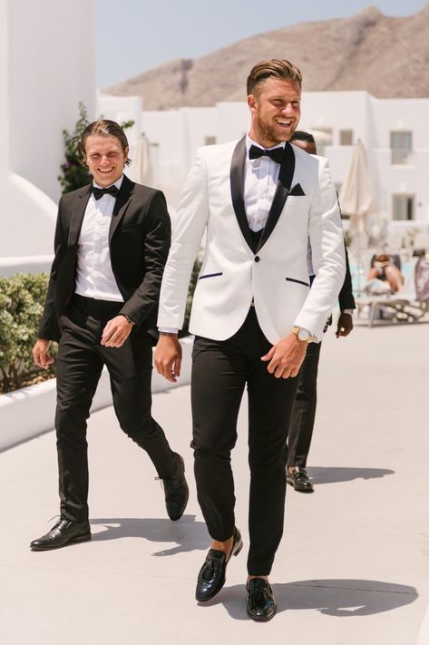 White Suit Groom & Groomsmen Suits, Modern Black Tuxedo Wedding, Black And White Mens Tuxedo, Men’s Wedding Tuxedo White, Grooms White And Black Suit, Men Tux Wedding, Black And White Mens Suits Wedding, White Tux Top Black Pants Men, Groomsmen Black And White Attire