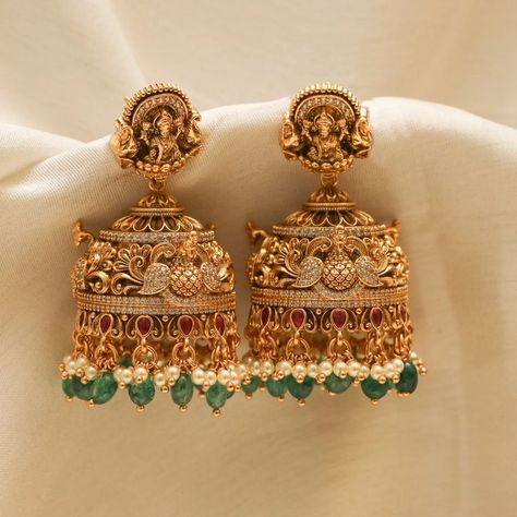 Show off India's culture and tradition by wearing perfectly handcrafted temple jewellery jhumkas! Explore our temple jewellery collection! Latest Design Earrings Gold, Gold Wedding Earrings Indian, Lakshmi Jhumkas Gold, Gold Antique Jhumkas, Cz Earrings Indian Gold, Temple Jewellery Earrings Antique, Antique Gold Jhumka, Temple Earrings Gold Jewelry, Jumka Earrings Gold Indian Jewelry