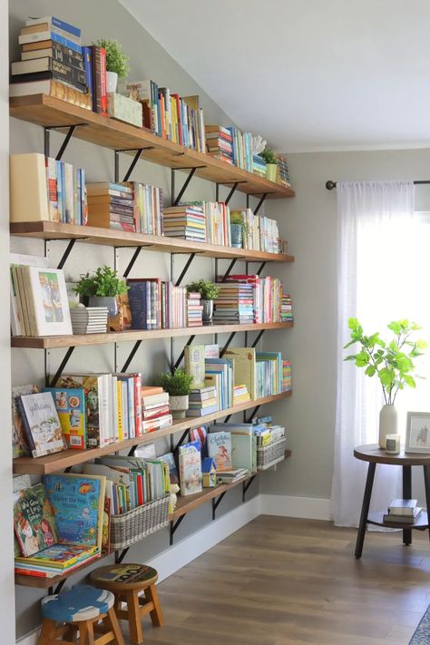 Long Wooden Shelves Living Room, Modern Home Library Ideas Bookshelf Wall, Open Shelving Library, Full Wall Floating Shelves Library, Bookshelf Next To Window, Wall Mounted Library, Books Shelves In Living Room, Open Shelves Library, Home Bookshelves Cozy Library