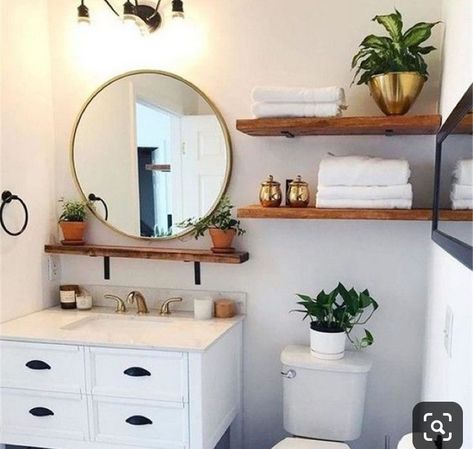 Round Wood Framed Mirror Bathroom, Floating Shelf Between Bathroom Mirrors, Above Toilet Organization, Boho Bathroom White Vanity, Open Shelving Above Toilet, Tiny Basement Bathroom Ideas, Bathroom Shelf Above Sink, Boho Bathroom Vanity Light, Small Bathroom Setup