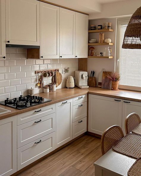 This kitchen has a white color scheme that is able to make the kitchen look bright and clean. Then, it is added with the brown wood color for a warm impression and not to make the decoration look boring. Bright Neutral Color Scheme from @mycozyhomely Small Kitchen Decor, 아파트 인테리어, Scandinavian Kitchen, Kitchen Room Design, Kitchen Inspiration Design, Apartment Kitchen, Design Kitchen, Ornament Crafts, White Cabinets