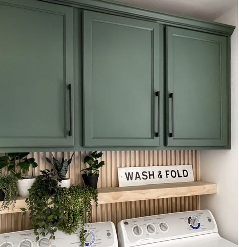 Laundry Room Pop Of Color, Green Accent Wall Laundry Room, Wood Backsplash Laundry Room, Laundry Room Makeover With Window, Small Black Laundry Room, Laundry Room Inspiration Modern, Laundry Space In Kitchen, Wood Slat Wall Laundry Room, Laundry Room Colored Cabinets