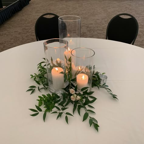 Inexpensive Greenery Centerpieces, Ivy And Candle Centerpieces, Smilax Centerpiece, Greenery Circle Table Centerpieces, Simple Gala Centerpieces, Round Table Decor For Party, Simple Dinner Centerpieces, Elegant Cheap Centerpieces, Square Wedding Centerpieces