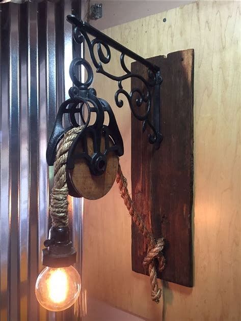 ways to display old pulleys - Search Images Antique Pulley Light, Antique Pulley Ideas, Pully Lights, Rustic Bedroom Lamps, Pulley Wall Light, Pulley Decor, Antique Pulley, Pulley Lamps, Pulley Light