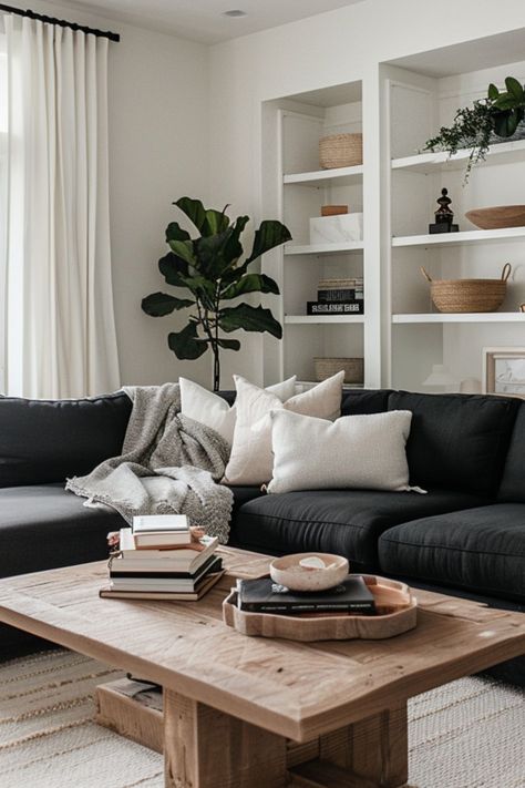 Lounge Decor Black Sofa, White Living Room Black Couch, Black White And Wooden Living Room, Black Couch With Pillows, Charcoal Sofa Decor, Neutral Living Room With Black Couch, Living Room With Charcoal Sofa, Black And White Photography Living Room, Black White Modern Living Room