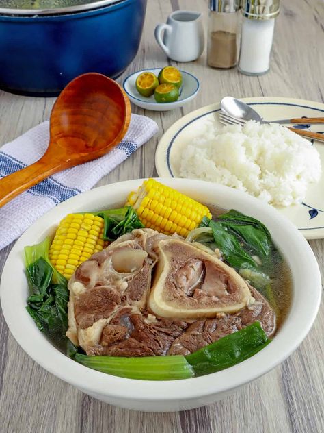 Warm up your tummy with a hearty bowl of Bulalo! Made with beef shanks, veggies, and a flavorful broth, this Filipino boiled soup is filling and delicious. Bulalo Recipe, Chicken Sotanghon Soup, Beef Shanks, Memes Pinoy, Kawaling Pinoy, Spaghetti With Ground Beef, Filipino Street Food, Ground Beef And Cabbage, Oxtail Soup