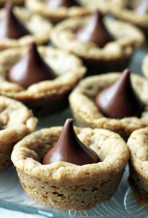 Peanut Butter Blossom Cookie Cups | Just About Baked Hershey Kiss Cookies Recipe, Cookies With Hershey Kisses, Peanut Butter Hershey Kiss Cookies, Kiss Cookies Recipe, Peanut Blossom Cookies, Kiss Cookie Recipe, Hershey Kiss Cookies, Peanut Butter Kiss, Peanut Butter Kiss Cookies