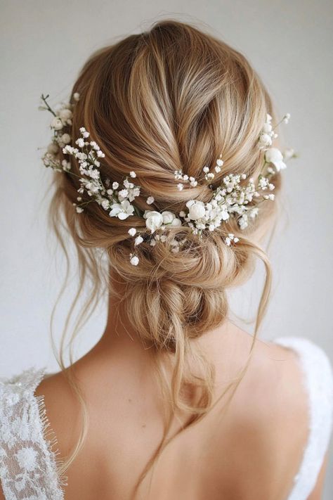 Give your bridal hair an ethereal touch with these 51 stunning ideas featuring floral charm. From flower-embellished buns to cascading blooms, these hairstyles capture timeless beauty. No matter your wedding vibe, these floral looks will enhance your style. Find your inspiration today! #bridalflowers #weddinghairinspo #floralvibes Wedding Hairstyles Updo With Hairpiece, Romantic Wedding Hair With Flowers, Wedding Hair Cottagecore, Wedding Flowers In Hair With Veil, Butterfly Hair Wedding, Low Bun Wedding Hair Flowers, Wedding Hair Accessories For Bride, Enchanted Wedding Hairstyles, V Back Wedding Dress Hairstyles