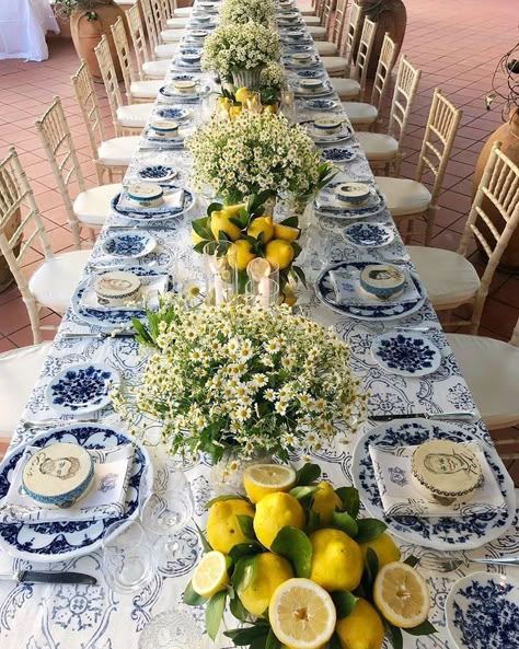 Mediterranean inspired tablescape. Custom designed table cloth, white and blue china bone chargers, tambourines with guests portraits and… Sangeet Board, White And Blue China, Lemon Tablescape, Mediterranean Party, Italian Bridal Showers, Mediterranean Table, Blue And White Plates, Bbq Night, Dinner Party Table Settings