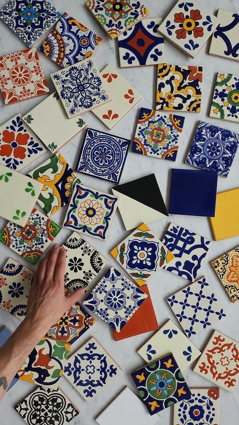 Hand-Painted Tiles1 Colorful hand-painted ceramic tiles laid out on a marble surface, featuring intricate traditional designs. | Sky Rye Design Hand Painted Ceramic Tiles, Tiles Aesthetic, Spanish Mosaic, Tile Aesthetic, Cool Tiles, Best Greige Paint, Best Greige, Azulejos Tiles, Ceramic Tile Art