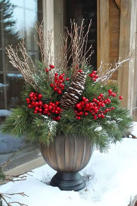 29 Winter Planter Ideas to Transform Your Outdoor Space This Season Decorate Planters For Christmas, Outdoor Planter Winter Ideas, Christmas Plants Outdoor, Outdoor Winter Urn Arrangements, Winter Porch Pots Christmas Arrangements, Outdoor Christmas Planters Farmhouse, Christmas Greenery Pots Front Porches, Winter Urn Planter Ideas, Winter Outdoor Pot Arrangements