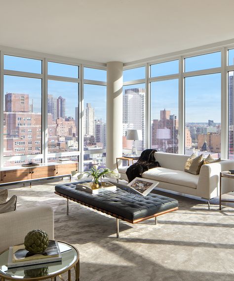 This home features exquisite floor-to-ceiling windows offering breathtaking views of the East River—take a look around! Pictured above, living room. New York Penthouse, Apartment View, Luxury Penthouse, Condo Living, Floor To Ceiling, New York Apartment, Nyc Apartment, Dream Apartment, Floor To Ceiling Windows