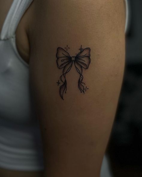 Tattoo Going Around Arm, Tattoo Ideas Teen Girl, Flower Bow Tattoo, Bow Garter Tattoo, Corset Bow Tattoo, Flower With Bow Tattoo, Bow Tattoo Lower Back, Unique Womens Tattoos, Bow Tattoos On Back Of Legs