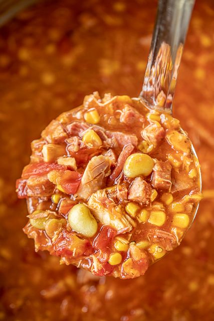 The BEST Brunswick Stew recipe EVER! Super easy to make and tastes great! Chicken, smoked sausage, pulled pork, onion, corn, tomatoes, and lima beans simmered in chicken broth, tomato sauce, vinegar, ketchup, brown sugar, and hot sauce. Can make on the stovetop or in the crockpot. Makes a ton, so it is great for a crowd. Serve with some cornbread or biscuits! We ate this three days in a row - SO good! #soup #stew #crockpot #slowcooker #gameday Brunswick Stew Recipe Easy, Best Brunswick Stew Recipe, Brunswick Stew Recipe, Stew Recipes Crockpot, Stew Crockpot, Slow Cooker Steak, Good Soup, Brunswick Stew, Homemade Cornbread