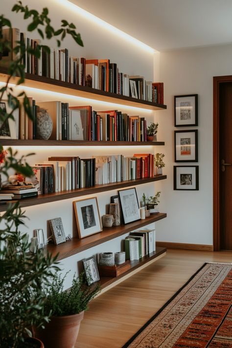 Turn your home office into a cozy home library with these tips and design ideas. Living Library Ideas, Library Wall Styling, Beachy Home Library, Den Library Ideas, Floating Shelves Library Bookshelves, Wall Shelf Library, Library Room Minimalist, Library In The Bedroom, Simple Home Library Ideas