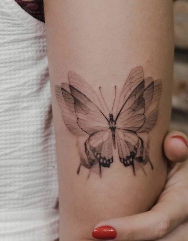 Fluttering Illusions: Mesmerizing 3D Butterfly Tattoo Designs for Inked Elegance Check more at https://ideatatto.com/drawings/fluttering-illusions-mesmerizing-3d-butterfly-tattoo-designs-for-inked-elegance/ 3d Butterfly Tattoo Designs, Geometric Tattoo Butterfly, Butterfly Wing Tattoo, Detailed Tattoos, 3d Butterfly Tattoo, Back Of Arm Tattoo, Wing Tattoo, Popular Characters, Butterfly Tattoo Designs