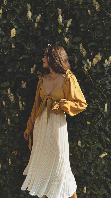 Click to shop outfit + more photos! Sarah Butler of @sarahchristine wearing Yellow Tie Front Crop Top and White Pleated Skirt in Seattle, Washington.