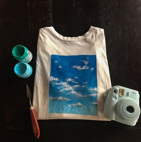 Giulietta-Tenné on Instagram: “Head in the clouds ☁️ Hand painted T-shirt! I love blue sky so I tried to catch it for you! Do you like it? Acrylic on T-shirt 💙” Acrylic Painting On T Shirts, Paint On Tshirt Acrylic, Tshirt Painting Ideas Acrylics, Gf Activities, Painting Shirt Ideas, Painting On Clothes T Shirts, Tshirt Painting Ideas Creative, T Shirt Painting Ideas Acrylics, Painting On Tshirts