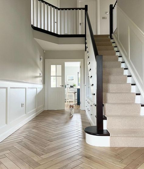 Large spacious hallway with white panelling and Cornforth White walls. Black And White Hallway, Modern Hallway Design, Amanda Allen, Stairs And Hallway Ideas, Stair Paneling, White Hallway, Cornforth White, Hallway Colours, Large Hallway