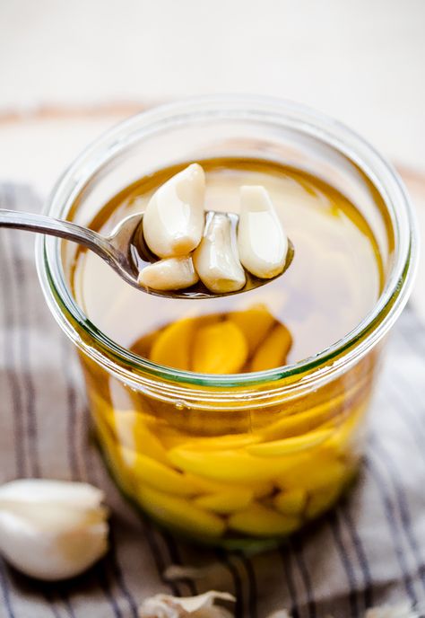 How to Make Garlic Confit and Homemade Garlic Oil. This delicious kitchen staple will take your dishes to the next level! #garlic #confit #abeautifulplate #howto #recipe Garlic In Olive Oil, Garlic Confit, Garlic Infused Olive Oil, Tandoori Masala, Garlic Olive Oil, Garlic Oil, Infused Olive Oil, Garlic Recipes, Grilling Chicken Breast