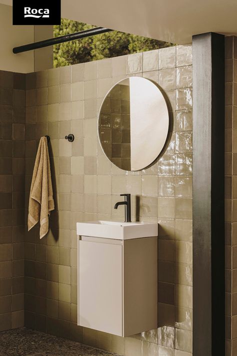 A wall mounted unit that has a white basin, black faucet and beige drawer. Above is a circular mirror. To the left are two black wall mounted hooks. Roca Bathroom, Space Light, Ensuite Bathroom, Small Bathrooms, Bathroom Collections, Bathroom Inspo, Small Bathroom Decor, Family Bathroom, Through The Window