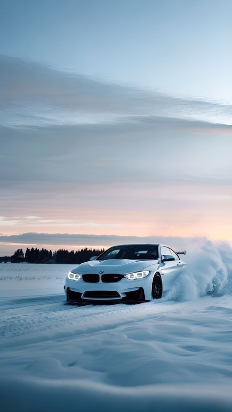 a white bmw car driving through the snow