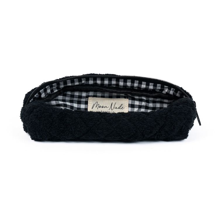 Our Space Pencil Case is a cute and stylish pouch designed to hold your stationery or brushes with a classic look.   The quilted black towel exterior is soft and luxurious, complemented by the elegant black & white gingham interior.  Ideal for storing your makeup brushes & eyeliners, or your pens & pencils (perfect for students), this bag is a must-have for those who appreciate both organization and style.  Size: 9" x 2" x 3" Gingham Interior, Storing Makeup Brushes, Black Pencil Case, Makeup Brush Case, Mini Makeup Bag, Large Makeup Bag, Black Towels, Vanity Bag, Mini Makeup