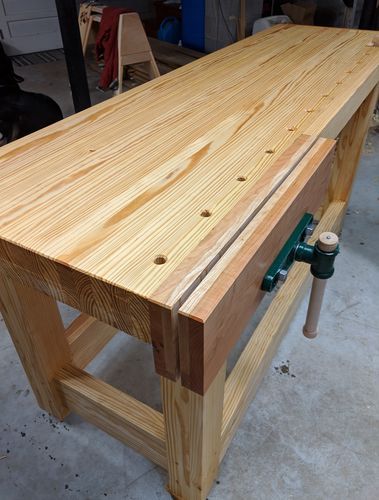 a work bench made out of wood in a garage