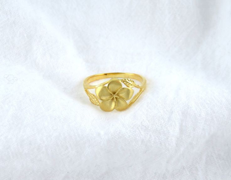 Discover our lovely Plumeria Flower Ring, made from durable 925 sterling silver and gently gold plated. This unique Hawaiian jewelry piece showcases a pretty plumeria flower design, perfect for everyday wear or special occasions, bringing a touch of island beauty to your style. Gold Flower-shaped Ring For Gift, Fine Jewelry Gold Flower Ring, Gold Flower Shaped Ring For Gift, Yellow Flower Jewelry For Anniversary, Delicate Flower-shaped Gold Ring, Delicate Gold Flower Ring, Yellow Flower Ring For Anniversary, Yellow Gold Birth Flower Rings, Yellow Gold Flower Ring With Birth Flower Detail