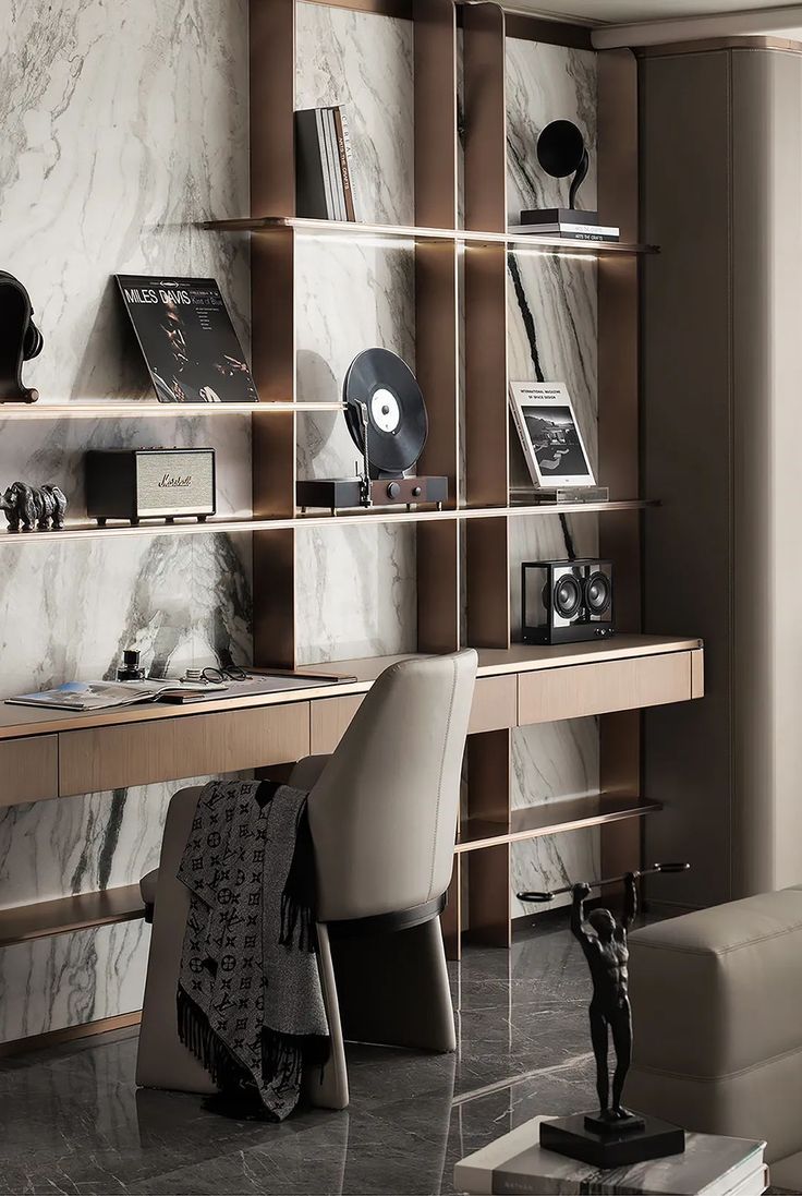 a room with a desk, chair and bookshelf