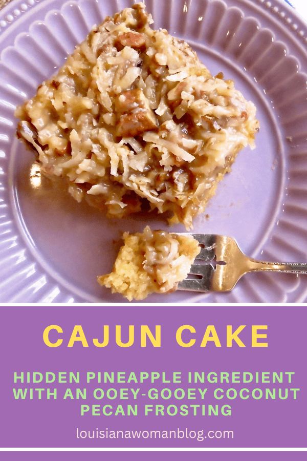 a close up of a piece of cake on a plate with the words cajun cake above it