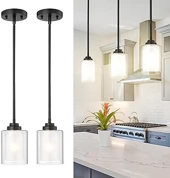 three lights hanging over a kitchen counter top