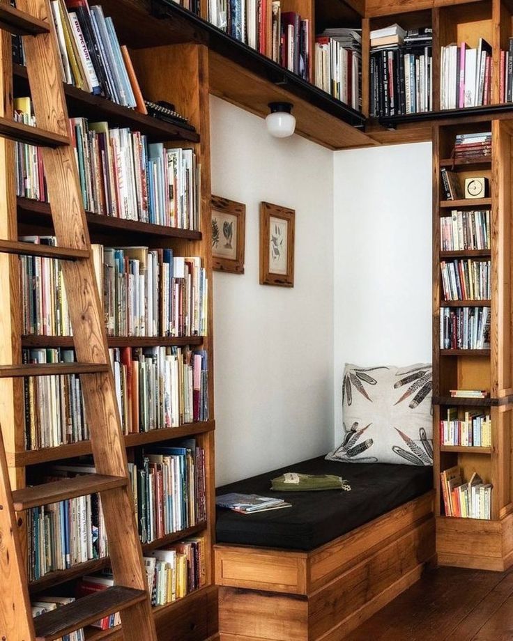 a room with bookshelves and a bed in it