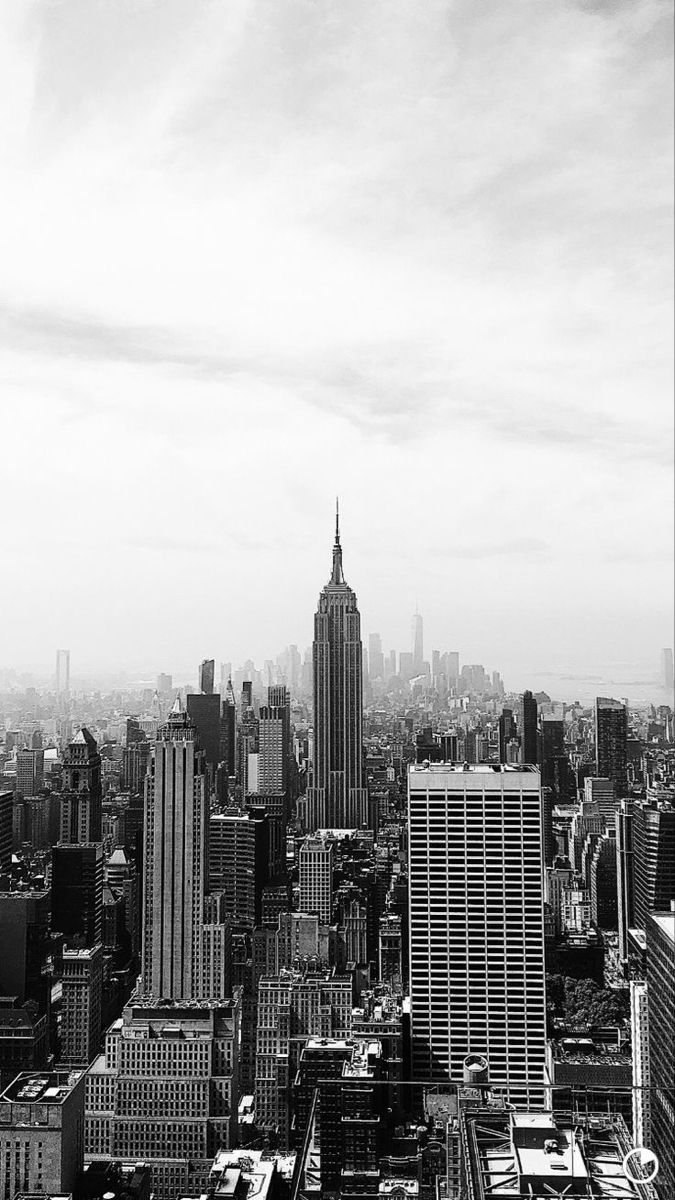 black and white photograph of city skyline with skyscrapers in new york, united states