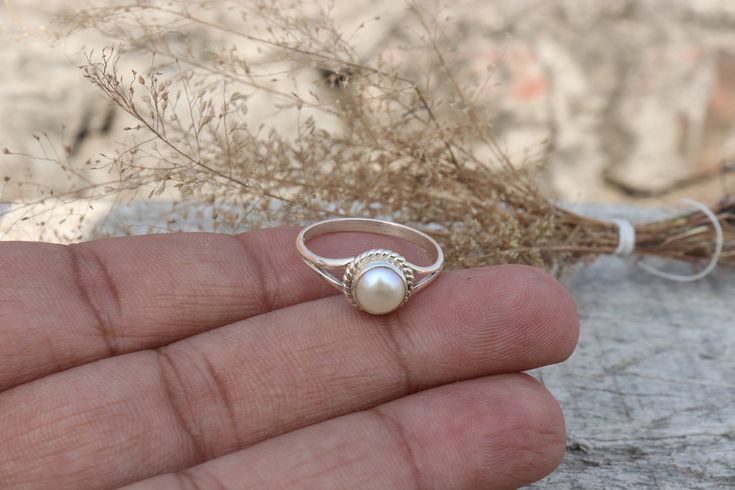 Item Details:- Natural Pearl Ring Stone Name - Pearl  Stone Size - 6 MM Stone Shape - Round Cabochon Quality - AAA Type - Natural Metal - 925 Silver Used Silver Weight - 1.5 to 2 Gram Approximate Payment Policy We accept payment through PayPal Payment should be made within 3 days of purchase. Delivery Time It is Handmade Item So Item will be Shipped within 3 to 5 Days after payment receive. The delivery time usually takes 11 to 24 days, depending which Country & location. We recommend you contact your local customs office if you have questions about this. Feedback If you are not satisfied with your purchased items then contact with us first before leaving negative or neutral feedback or opening disputes. We believe in solving the issues. A positive feedback represents our service, product Tiny White Rings For Anniversary, Handmade Pearl Open Ring For Anniversary, Handmade Moonstone Toe Ring As A Gift, Unique Pearl Ring For Gift, Handmade Pearl Ring For Anniversary, Handmade Crystal Ring For Gift, Handmade Crystal Ring Gift, Handmade Stackable Promise Rings, Nickel Free White Round Ring