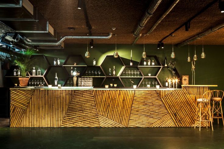 the bar is decorated with wooden panels and hanging lights