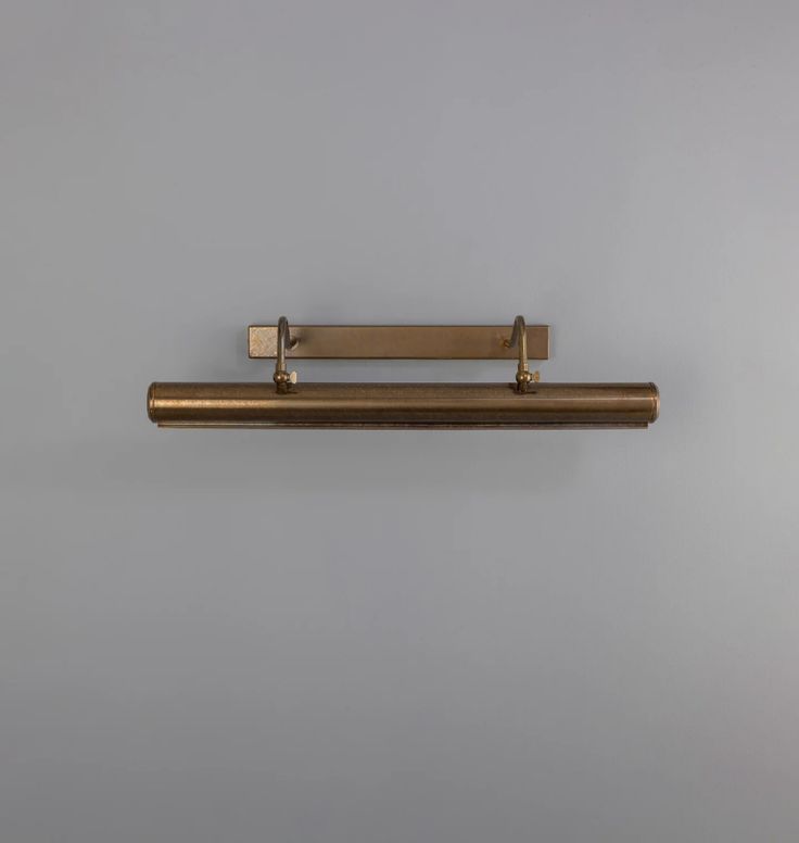 a metal shelf mounted to the side of a wall