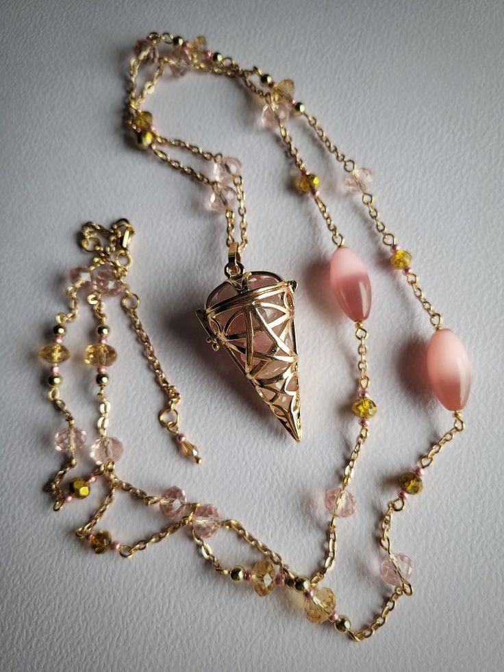 Openable pendulum necklace with strawberry quartz inside. 🩷  #diy #handmade #witchy #witch #fairy #necklace #goddess #pendulum #jewellery #jewelry #crystals #noita #keiju #kaulakoru #heiluri #teeseitse #askartelu Pendulum Aesthetic, Pendulum Diy, Spiritual Necklaces, Witch Fairy, Pendulum Necklace, Jewellery Aesthetic, Spiritual Necklace, Handmade Crystal Jewelry, Dream Aesthetic