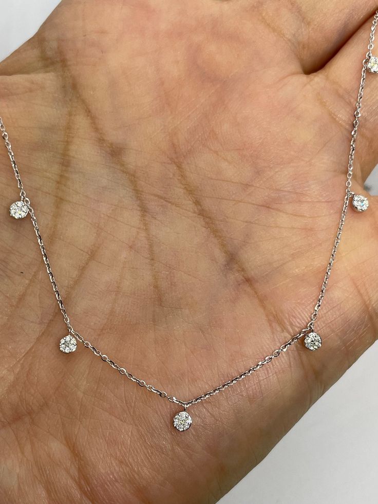 "Beautiful Dainty Diamond Necklace White Gold.  Dainty 7 diamond clusters around the neck for everyday wear.   Excellent craftsmanship, the diamonds are very sparkling and set nice and smooth.  The drops measures 3mm.  The chain comes with extra loops so you can wear at 17.5\", 16.5\", or 15.5\" lengths.  The chain is diamond cut so it has nice sparkles to it.   Genuine round brilliant cut diamonds  Total weight: 0.22 Carats Clarity: SI Color: G Solid 18K White Gold  Comes with gift box * We have been in the wholesale Jewelry business for over 30 years serving the community at the same location.  All diamonds we use are natural stones and set in fine quality gold.  Absolutely NO clarity enhanced or treated diamonds. Our jewelry pieces are handcrafted with fine craftsmanship and good qualit Diamond By The Yard, Basic Mehndi, Dainty Diamond Necklace, Necklace Ideas, Diamond Choker, Necklace Diamond, Dainty Chain, Sell Gold, Necklace White