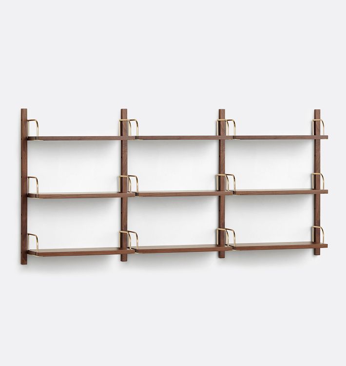 a wall mounted shelf with several shelves and hooks on the sides, against a white background