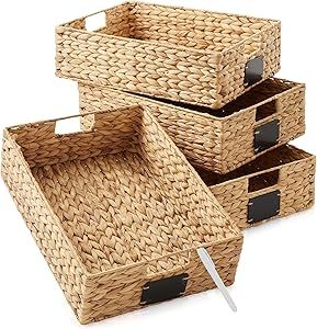 four woven baskets with handles are stacked on top of each other and one has a knife in it